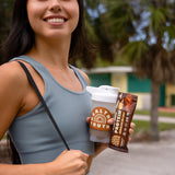 Smiling woman in athletic wear holding a 'Healthy Truth' protein shaker and a Chocolate Sea Salt plant-based protein bar, standing outdoors with trees and a building in the background.