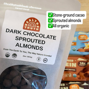 Package of dark chocolate sprouted almonds with a visible brand label on a table.