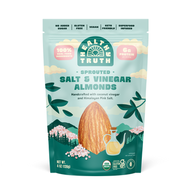 A pouch of Health Truth sprouted salt and vinegar almonds with illustrations of almonds, a shaker of salt, and floral designs against a blue background.