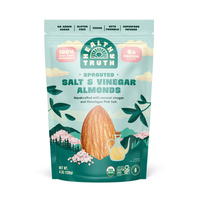 A pouch of Health Truth sprouted salt and vinegar almonds with illustrations of almonds, a shaker of salt, and floral designs against a blue background.