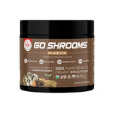 Go Shrooms Mushroom" superfood blend by Healthy Truth. The label is brown with white text and features highlights such as "5 Mushrooms," "3g Net Carbs," "No Added Sugar," and "No Additives." The product is labeled "Proprietary Mushroom & Superfood Blend" and "100% Plant-Based & Organic Whole Foods." Images of mushrooms and roots are visible, along with certification icons including USDA Organic and Non-GMO.