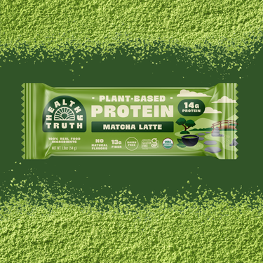 Green protein bar packaging with matcha latte flavor on a green background