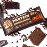 A Healthy Truth plant-based protein bar in Chocolate Sea Salt flavor on a white background, surrounded by chunks of chocolate and cocoa nibs, with the wrapper highlighting key features like 15g protein, 11g fiber, organic certification, and being gluten- and dairy-free.