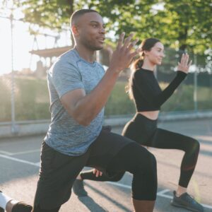 two people stretching